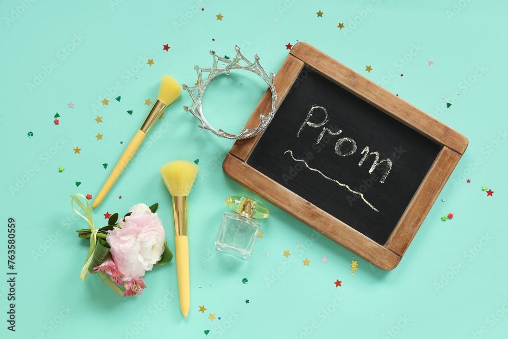 Chalkboard with text PROM, crown and makeup brushes on turquoise background