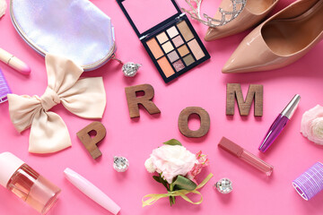 Word PROM with female shoes, crown and makeup products on pink background