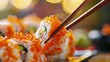 A close-up view captures the experience of enjoying sushi in a restaurant, with chopsticks delicately grasping a California sushi roll. 