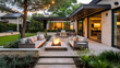A tranquil outdoor living space with modern beige furniture, a fire pit, ambient string lights, and lush landscaping, ideal for relaxing evenings under the stars.