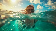 A Tropical Adventure As A Female Swimmer Immerses In Crystal-clear Ocean Waters, Reflecting Freedom And Joy Under The Shining Sun