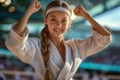 © Space Priest - A girl trains in karate classes. Backdrop with selective focus and copy space