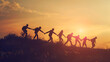 Silhouette of friends at sunset background against blue sky Freedom unity and friendship human bridge