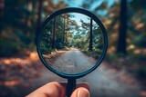 Fototapeta Tulipany - Evaluating Forest Path Ahead: A Handheld Magnifying Glass Perspective