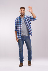 Leinwandbilder - Man, portrait and wave hello in studio for happy greeting on white background or communication, friendly or mockup space. Male person, face and hand gesture for welcome sign, recognition or farewell