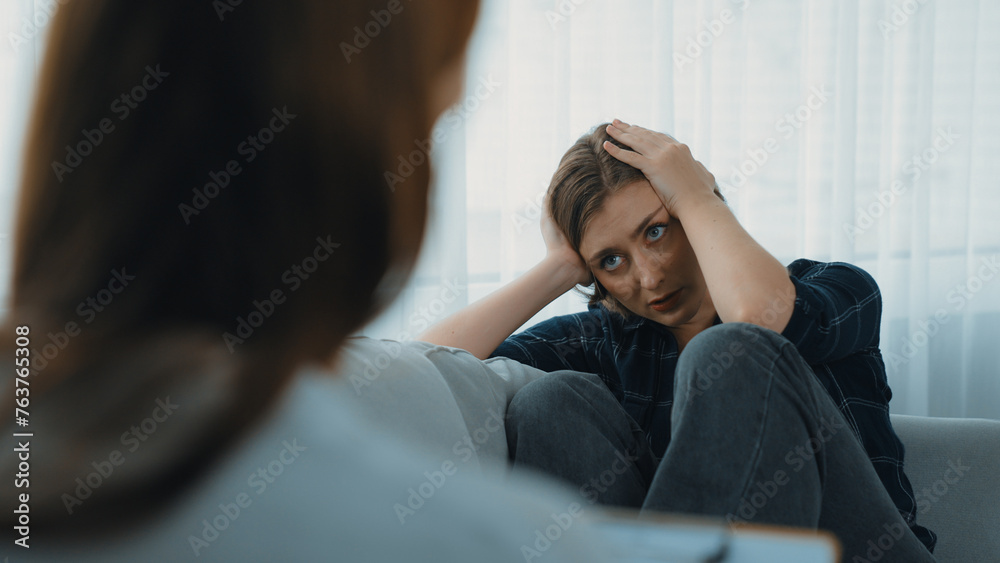 Sad PTSD woman patient in therapy for mental health with psychologist ...