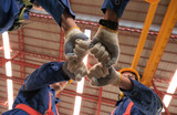 Fototapeta  - Team of engineers stack hands to motivate and working at the factory.