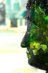 Poster - Ancient Buddha face with gold leaf