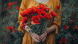 Beautiful woman hands holding a bouquet of red poppy flowers background as a symbol of both remembrance and hope for a peaceful future