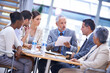 © Tabitha R/peopleimages.com - Group, businesspeople and meeting discussion together in office, diversity teamwork with professionals. Partnership, collaboration with staff in workplace for business merger, law firm with paperwork