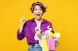 © ViDi Studio - Young woman wear purple shirt hold basin with detergent bottles do housework tidy up hold index finger up with great new idea isolated on plain yellow background studio portrait. Housekeeping concept.