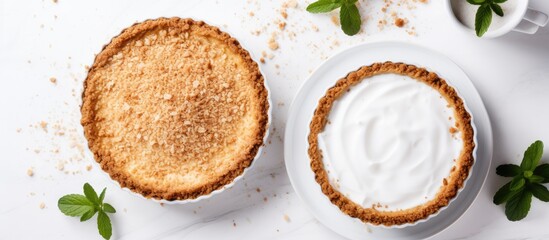 Sticker - Two delicious pies topped with creamy whipped topping on a clean white surface