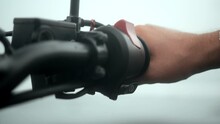 Caucasian Man Rides Motorcycle. Close-up Of A Man's Hand Push Button Starts The Bike