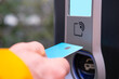 close-up man holding bank card to pay for charging station, electric vehicle charger factory, alternative energy, Everyday Convenience, sustainable development in Technology, Frankfurt, Germany