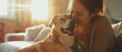 © arhendrix - Female pet sitter, Caucasian, joyfully playing with a dog in a sunlit modern living room,