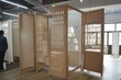 customer choosing among various designs of office partitions