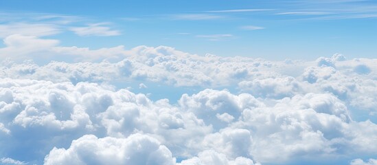 Wall Mural - The image features a sky filled with numerous clouds floating above the Earth's surface