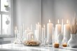 still life with burning candles in white modern interior