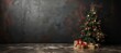 Festive christmas tree with gifts against dark gray wall, bokeh lights, blank space for text