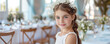 Beautiful young girl in white dress in restaurant celebrating her First  Holy Communion. Banner with copyspace. Shallow depth of field.