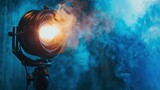 Fototapeta Kosmos - Cinema spotlight with smoke blue neon light, professional cinema light, cinema and entertainment concept.