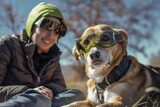 Fototapeta Londyn - dog with protective solar viewing glasses beside owner
