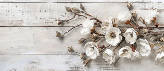 Wall Mural - A cluster of white flowers elegantly placed on a white wooden table, creating a serene and charming display of nature meets art