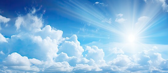 Wall Mural - A close-up view of a vibrant sun radiating through the clear, blue sky, creating a beautiful and serene image