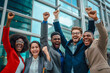 Excited diverse business team employees screaming celebrating good news with their fists up in the air. Business win corporate success, happy colleagues cheering in front of company building