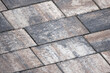 Rough gray cobble road background, paving slabs