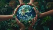 World Earth Day Concept.Hands of People Embracing green earth. Green Energy, ESG, Renewable and Sustainable Resources. Environmental Care.