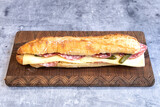 Fototapeta Londyn - Salami and cheese tasted sandwich