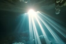 Sunlight Piercing Through An Opening Of A Submerged Cave