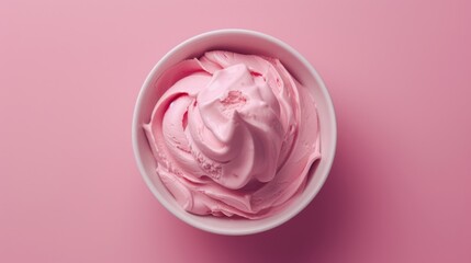 Wall Mural - Bowl of pink ice cream isolated on pink background. Top view