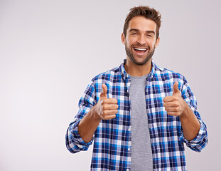 Aufkleber - Portrait, excited and man with thumbs up for success, winning or feedback isolated on a gray studio background mockup space. Face, happy person and like hand gesture for emoji, agreement or thank you
