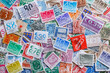 © bukhta79 - Ukraine, Kiyiv - January 12, 2023 Netherlands Postage stamps..Postage stamps.A collection of world stamps in a pile.Postage stamps from different countries and times