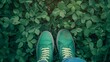 A Green canvas shoes on plants, walking green, eco friendly products, text space - Green shoes on leaves