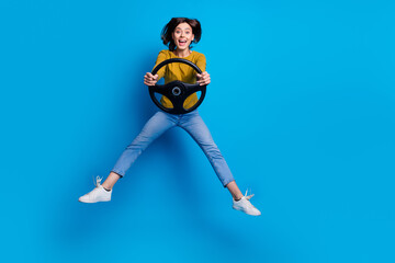 Sticker - Full length photo of cute impressed woman wear shirt rising auto jumping empty space isolated blue color background