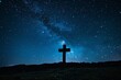 Starlit sky with a silhouette of a cross on a hill, symbolizing eternal hope and guidance under the night sky.
