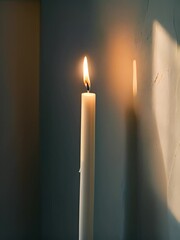 Wall Mural - two lit candles sitting next to each other on a table