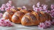  A plateau of croissants dusted with powdered sugar, surrounded by blossoms