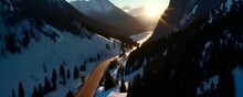 snowy mountain road, surrounded by towering peaks blanketed in pristine snow under soft glow of setting sun