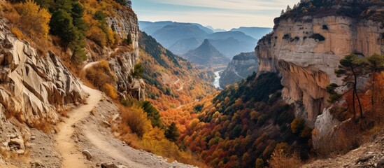 Wall Mural - Trail winding through mountain landscape