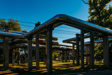 Wall Mural - Steel pipelines outgoing from the plant at sunny day