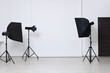 © New Africa - White photo background and professional lighting equipment in studio