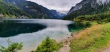 Fototapeta Do pokoju - Mountain lake surrounded by mountains in Austria. Gosaus, Austria 2022