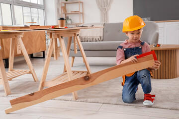 Sticker - Cute little builder measuring wooden plank in room