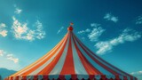 Fototapeta  - Vibrant circus tent against a blue sky