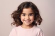 © Iigo - Portrait of a cute little girl with curly hair, studio shot