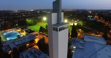 Aerial Forward Shot Of Tall Building In Residential City At Dusk - Culver City, California
